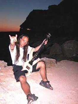 a111_me_sitting_in_the_window_of_the_cave_at_sundown